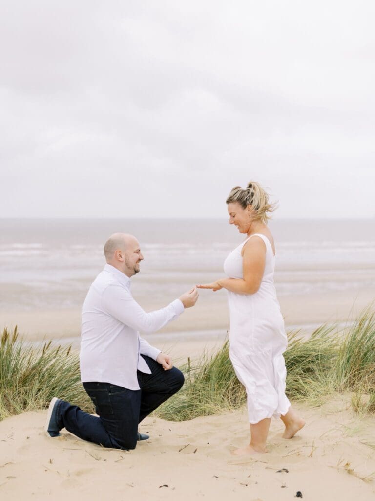 Lauren and fiancé Mark captured getting engaged on the beach by Heledd Roberts photography